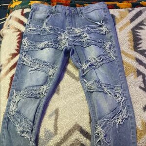 Distressed Blue Denim Jeans